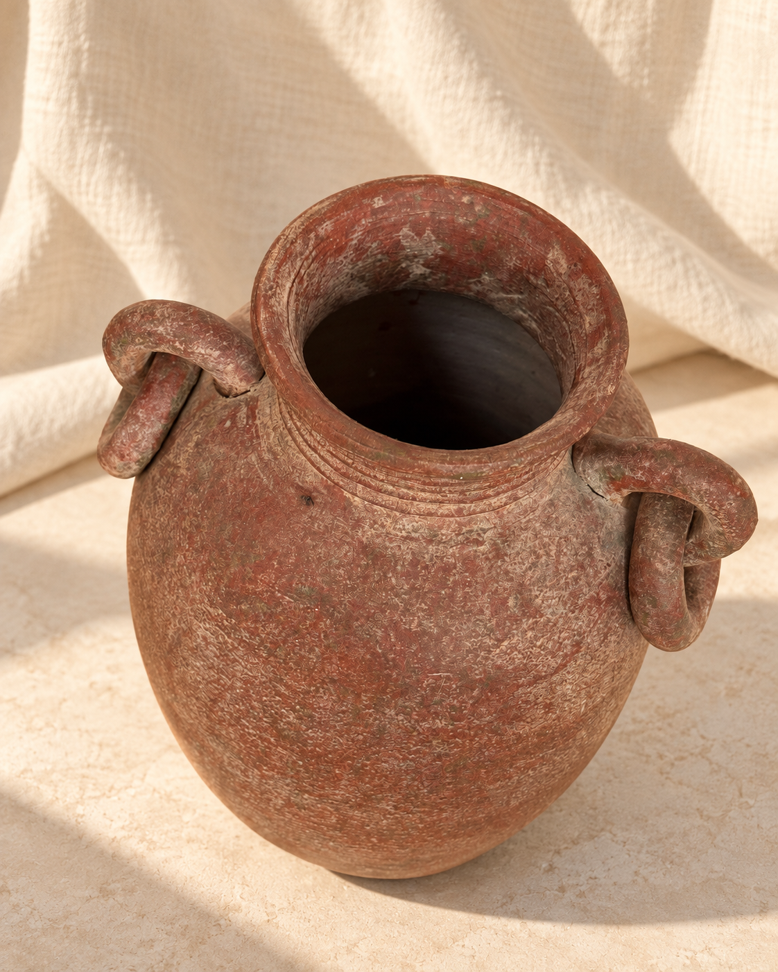 Close-up of weathered terracotta surface on antique amphora