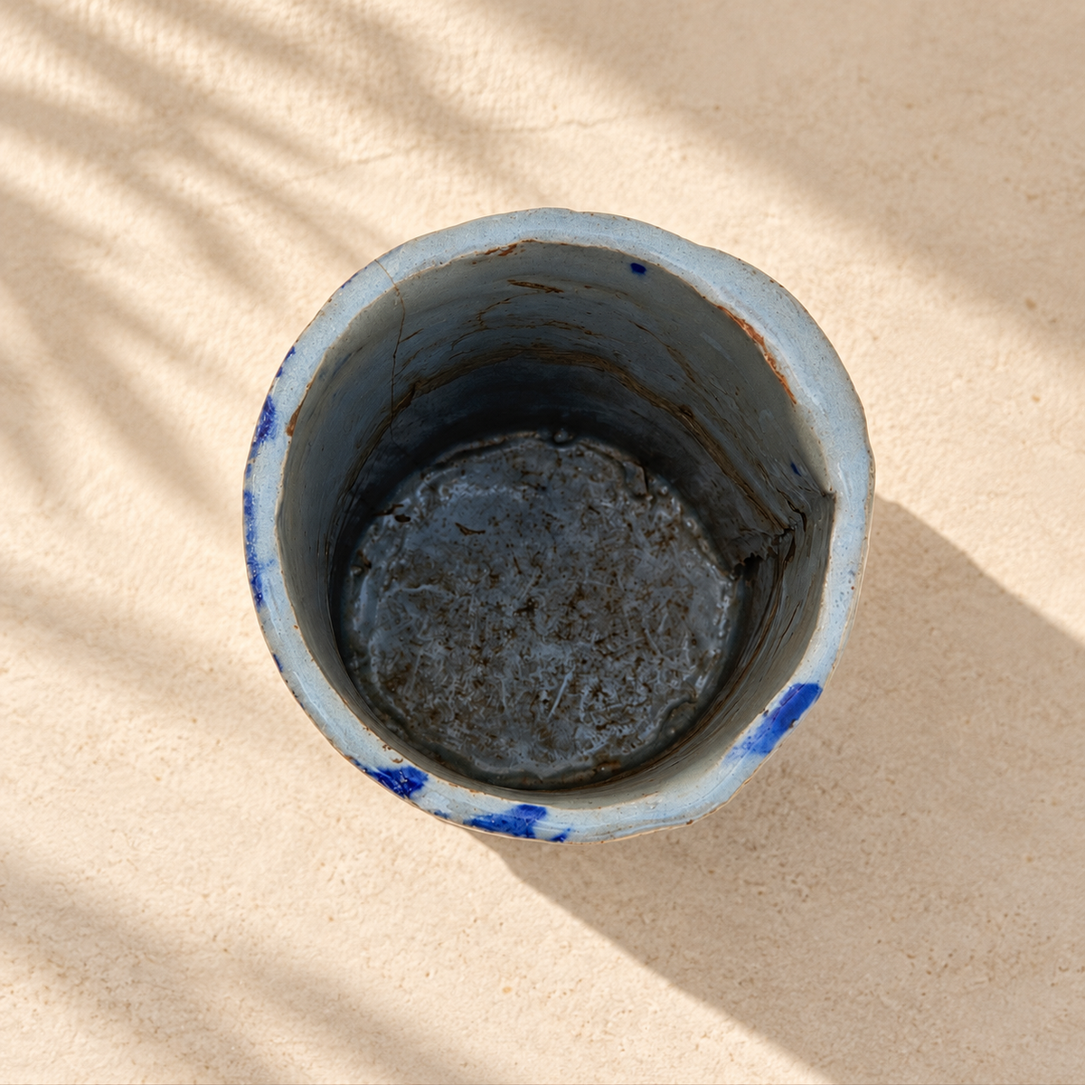 Top view of blue studio pottery vase showing the opening