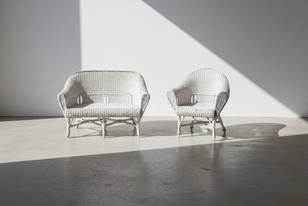 Vintage white wicker loveseat and armchair set with barrel backs