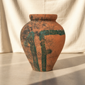 Rustic terracotta storage jar with hand-painted green abstract motifs