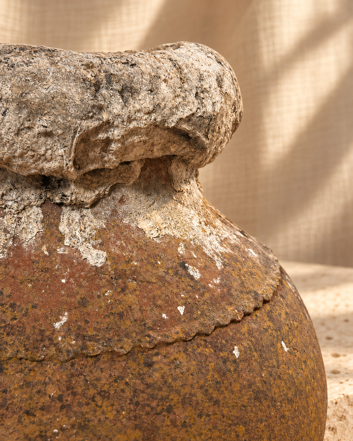 Side view of antique Mediterranean terracotta amphora with tapered hand-formed body and heavily calcified weathered surface — Hommes and Gardens, Vases + Vessels Collection, Objects + Curiosities Collection, Home Decor, Landscape Architect, Interior Designer, Outdoor Living, Home Design, Luxury Design, Art, Objects, Mediterranean Decor, Antique Pottery, Nature, Backyard, Yard.