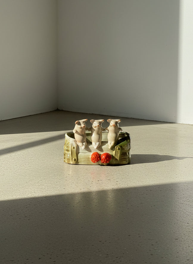 vintage ceramic pig planter with log design and strawberry accents