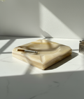 1960s cream-coloured stone ashtray with clean geometric lines, four cigarette rests, and polished finish, a timeless mid-century collectible — Hommes and Gardens, Smoke + Fire Collection, Decorative Objects, Landscape Architect, Interior Designer, Outdoor Living, Outdoor Decorations, Home Design, Luxury Design, Art, Furniture, Objects, Best Gifts, Nature, Backyard, Yard.