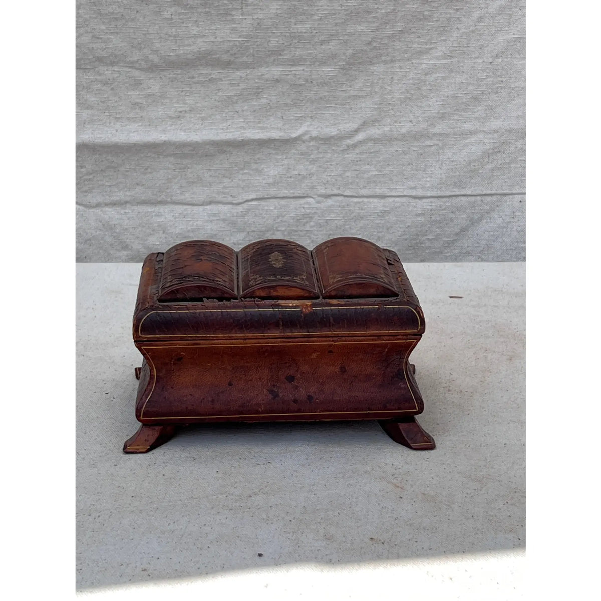 19th century small leather-wrapped jewelry box with gilded iron accents and exotic wood legs, showcasing fine craftsmanship and antique charm — Hommes and Gardens, Objects Collection, Landscape Architect, Interior Designer, Outdoor Living, Art, Furniture, Objects, Best Gifts, Nature, Backyard, Yard, Outdoor Decorations, Home Decor, Home Design, Luxury Design.