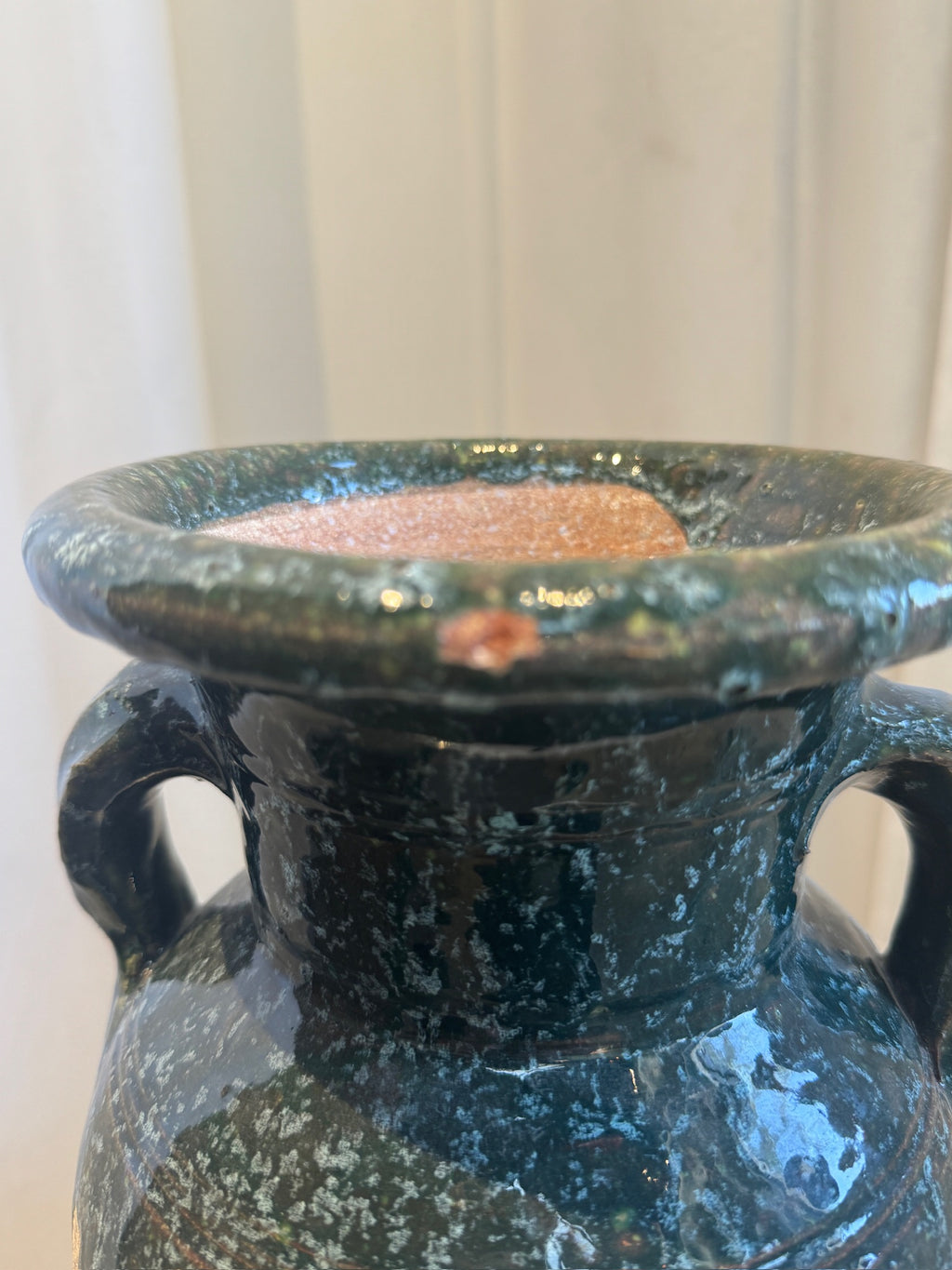 Close-up of the rim and handles of a Vintage Glazed Terracotta Amphora Vase with Drip Glaze Detailing from hommes + gardens estudio.