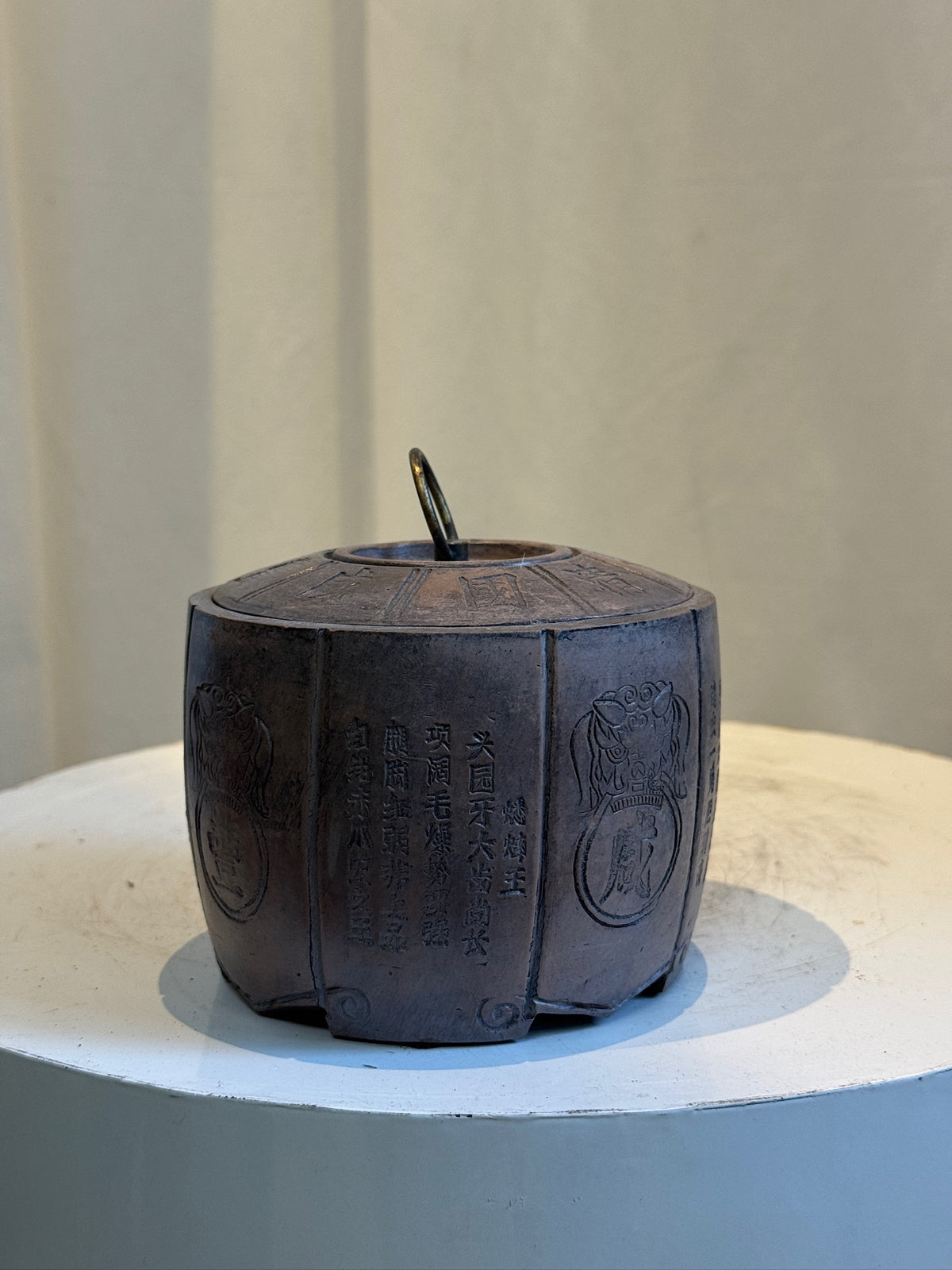 Antique Asian clay jar inspired by Qing Dynasty, featuring detailed calligraphy, lid with loop handle, and natural brown finish — Hommes and Gardens, Objects Collection, Landscape Architect, Interior Designer, Outdoor Living, Art, Furniture, Objects, Best Gifts, Nature, Backyard, Yard, Outdoor Decorations, Home Decor, Home Design, Luxury Design.