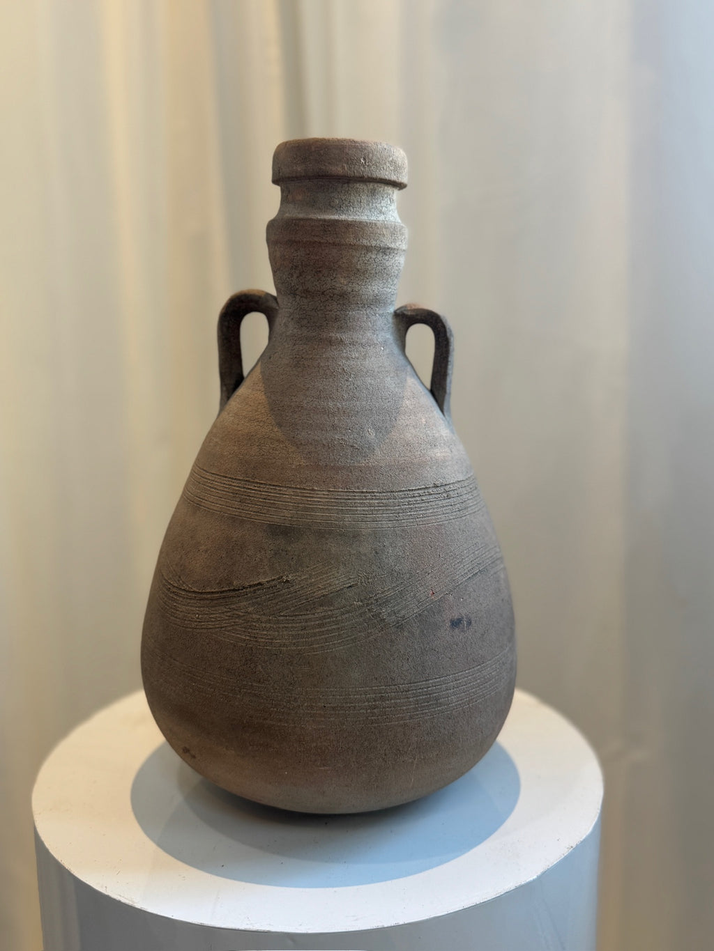 Antique Classical Roman terracotta amphora featuring gracefully curved handles, aged patina, and finely incised ridges, perfect for historical decor — Hommes and Gardens, Vases + Vessels Collection, Landscape Architect, Interior Designer, Outdoor Living, Art, Furniture, Objects, Best Gifts, Nature, Backyard, Yard, Outdoor Decorations, Home Decor, Home Design, Luxury Design.