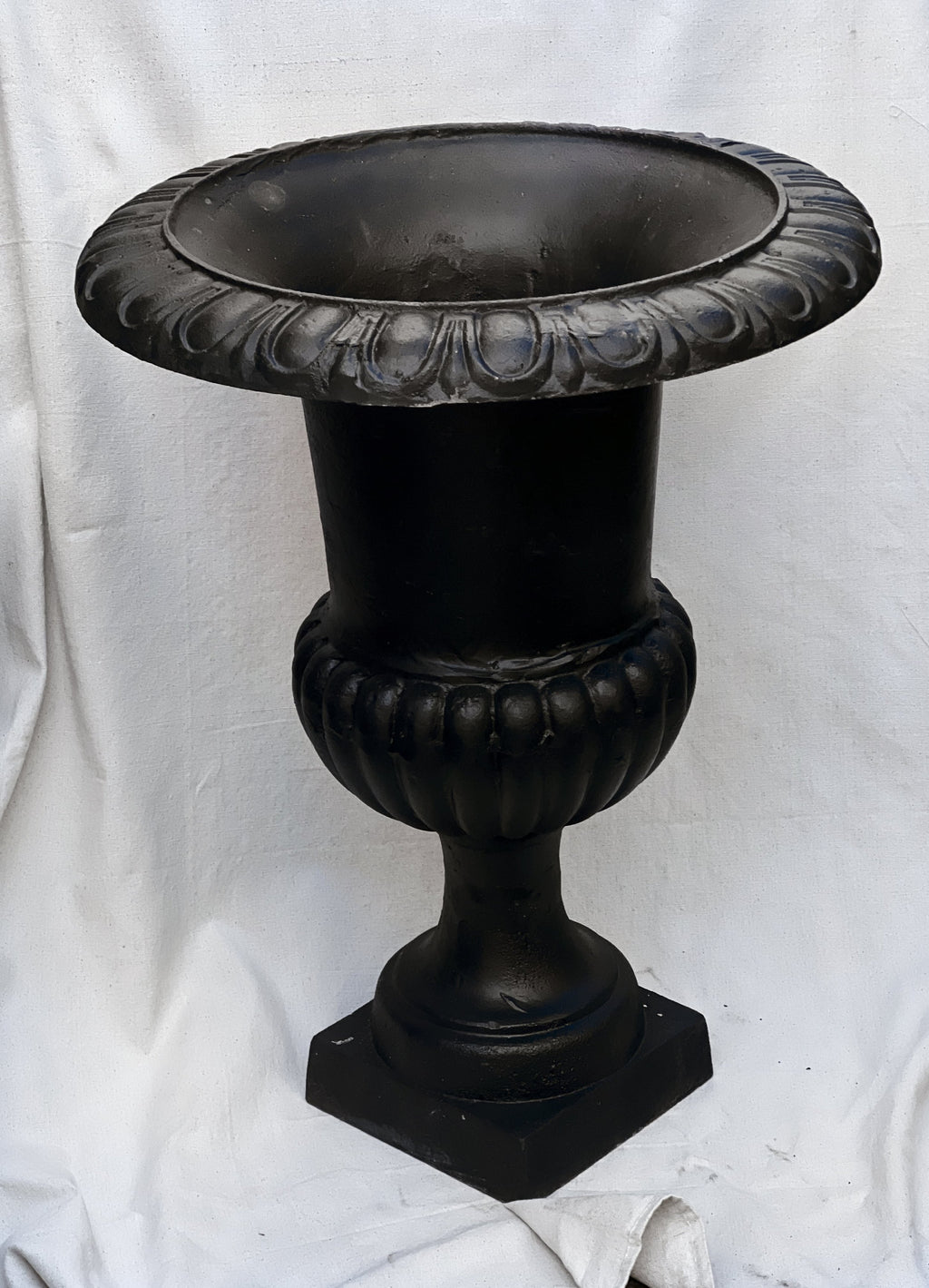 Pair of 29" French Cast Iron Urn Black Planters featuring ornate details and a classic design. hommes + gardens estudio