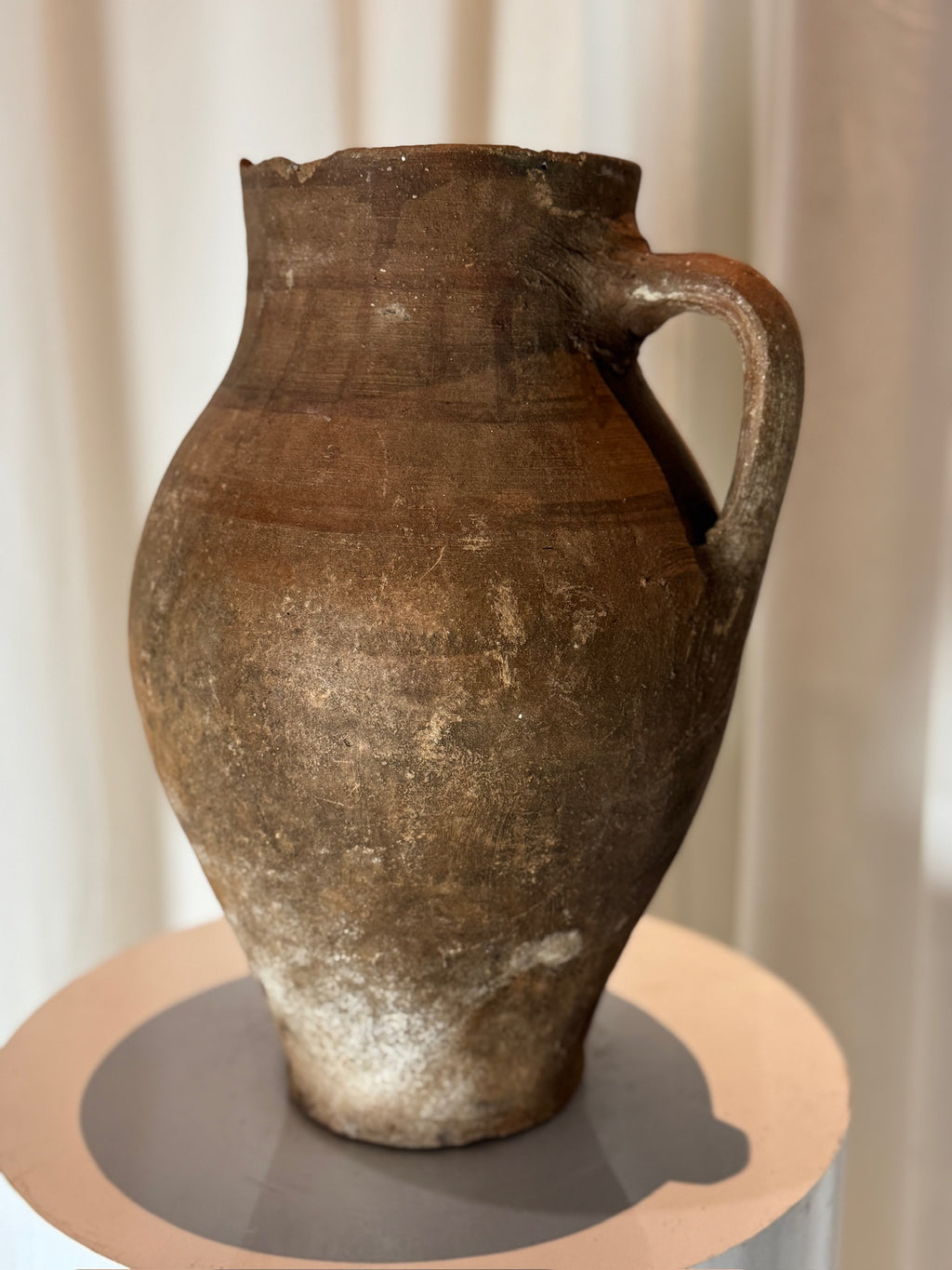 Antique handcrafted terracotta water jug with rustic earthenware body, curved handle, and warm natural patina, timeless Mediterranean-style décor piece — Hommes and Gardens, Vases + Vessels Collection, Landscape Architect, Interior Designer, Outdoor Living, Art, Furniture, Objects, Best Gifts, Nature, Backyard, Yard, Outdoor Decorations, Home Decor, Home Design, Luxury Design.