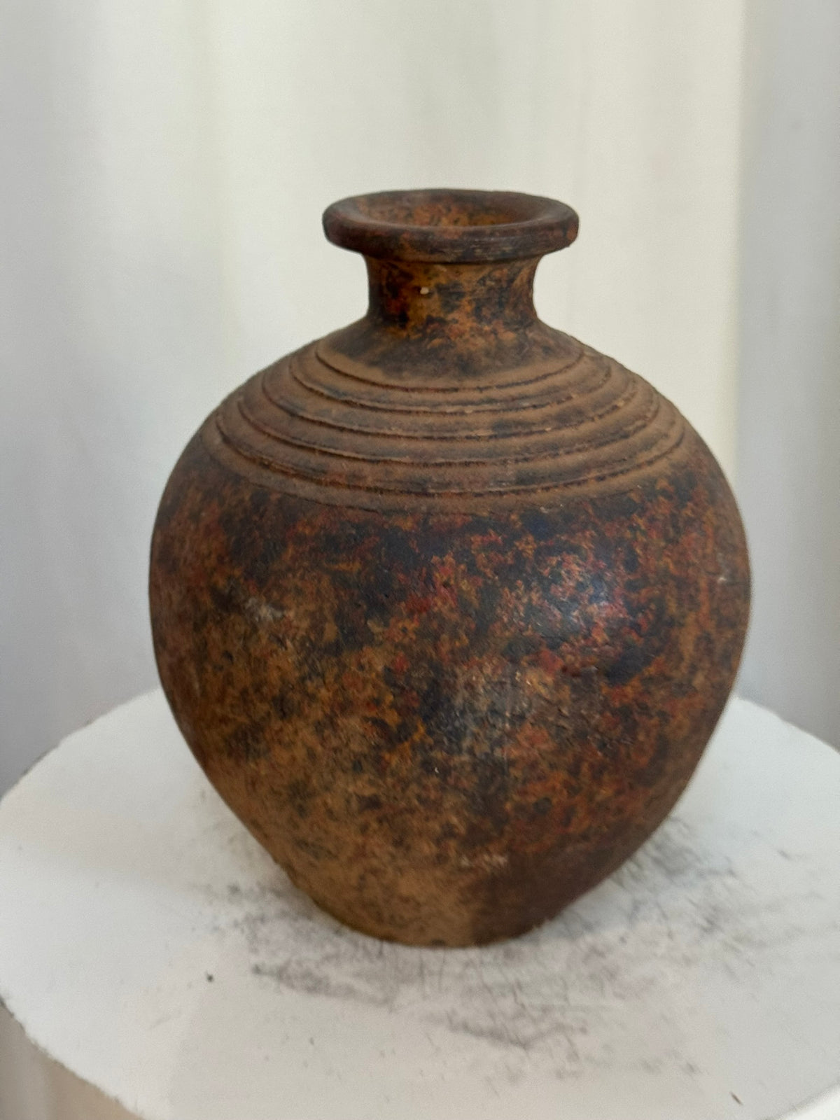 Antique-inspired handcrafted ceramic vase with aged earthy patina, concentric ridges, and textured surface, blending rustic and traditional charm — Hommes and Gardens, Vases + Vessels Collection, Landscape Architect, Interior Designer, Outdoor Living, Art, Furniture, Objects, Best Gifts, Nature, Backyard, Yard, Outdoor Decorations, Home Decor, Home Design, Luxury Design.