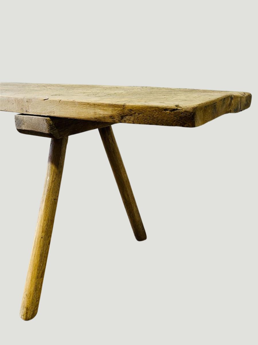 Antique primitive European wood bench console with a beautiful bleached patina, three-legged design and hand-carved surface, perfect for rustic interiors — Hommes and Gardens, Furniture Collection, Landscape Architect, Interior Designer, Outdoor Living, Art, Furniture, Objects, Best Gifts, Nature, Backyard, Yard, Outdoor Decorations, Home Decor, Home Design, Luxury Design.