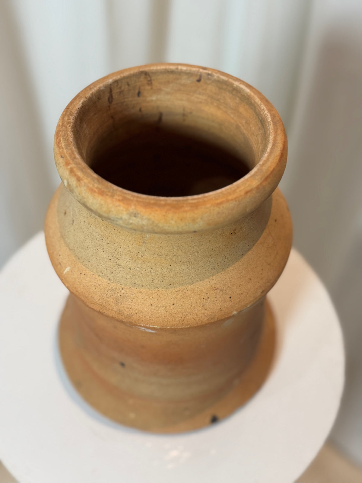 Antique two-piece terracotta hourglass pot featuring sculptural rustic form, earthy tones, and weathered patina, a timeless handcrafted pottery centerpiece — Hommes and Gardens, Pots + Planters Collection, Landscape Architect, Interior Designer, Outdoor Living, Art, Furniture, Objects, Best Gifts, Nature, Backyard, Yard, Outdoor Decorations, Home Decor, Home Design, Luxury Design.