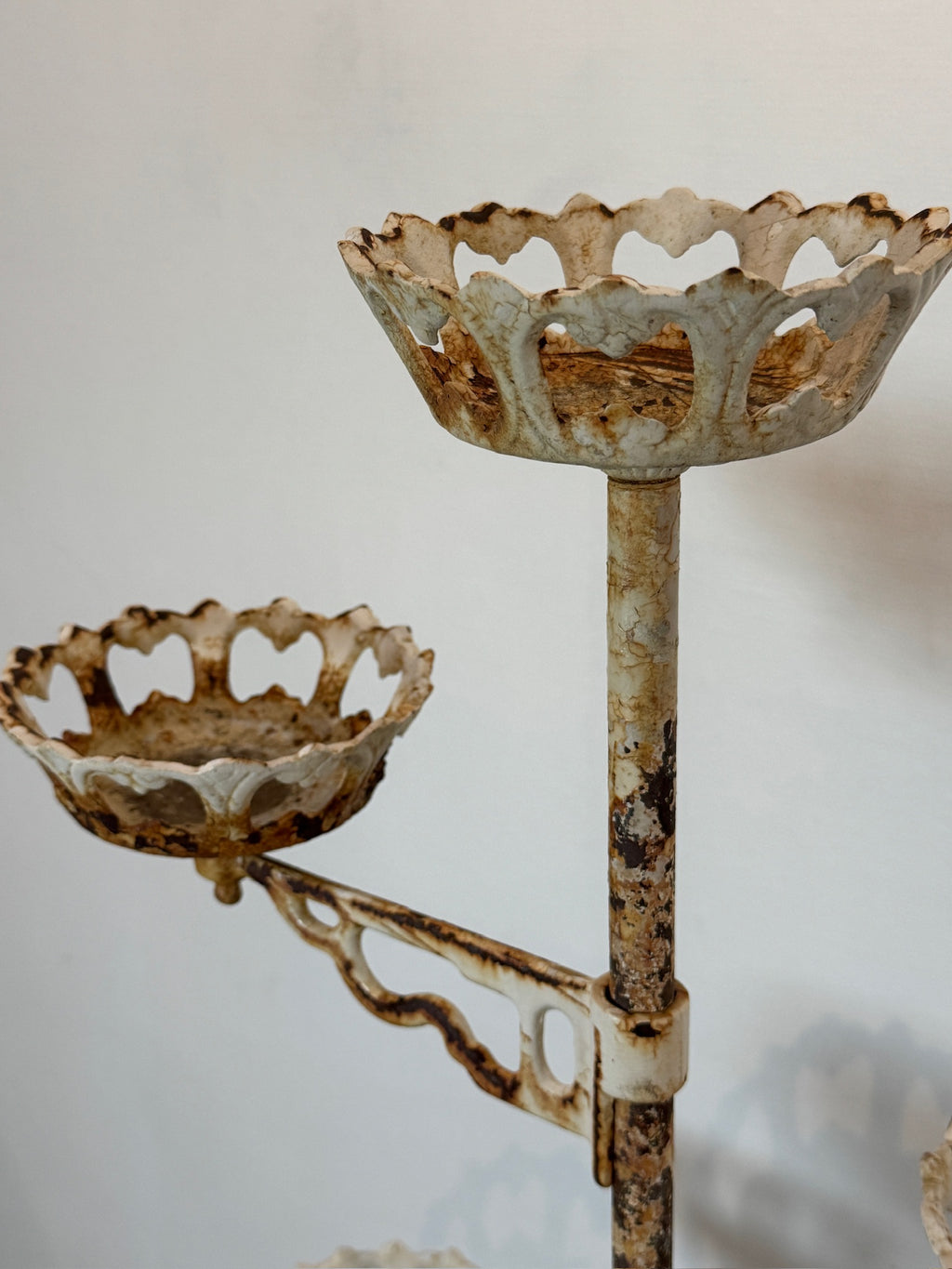 Antique Victorian revolving cast iron plant stand featuring ten flower-shaped holders, Rococo-style detailing, and aged distressed patina — Hommes and Gardens, Pots + Planters Collection, Landscape Architect, Interior Designer, Outdoor Living, Art, Furniture, Objects, Best Gifts, Nature, Backyard, Yard, Outdoor Decorations, Home Decor, Home Design, Luxury Design.
