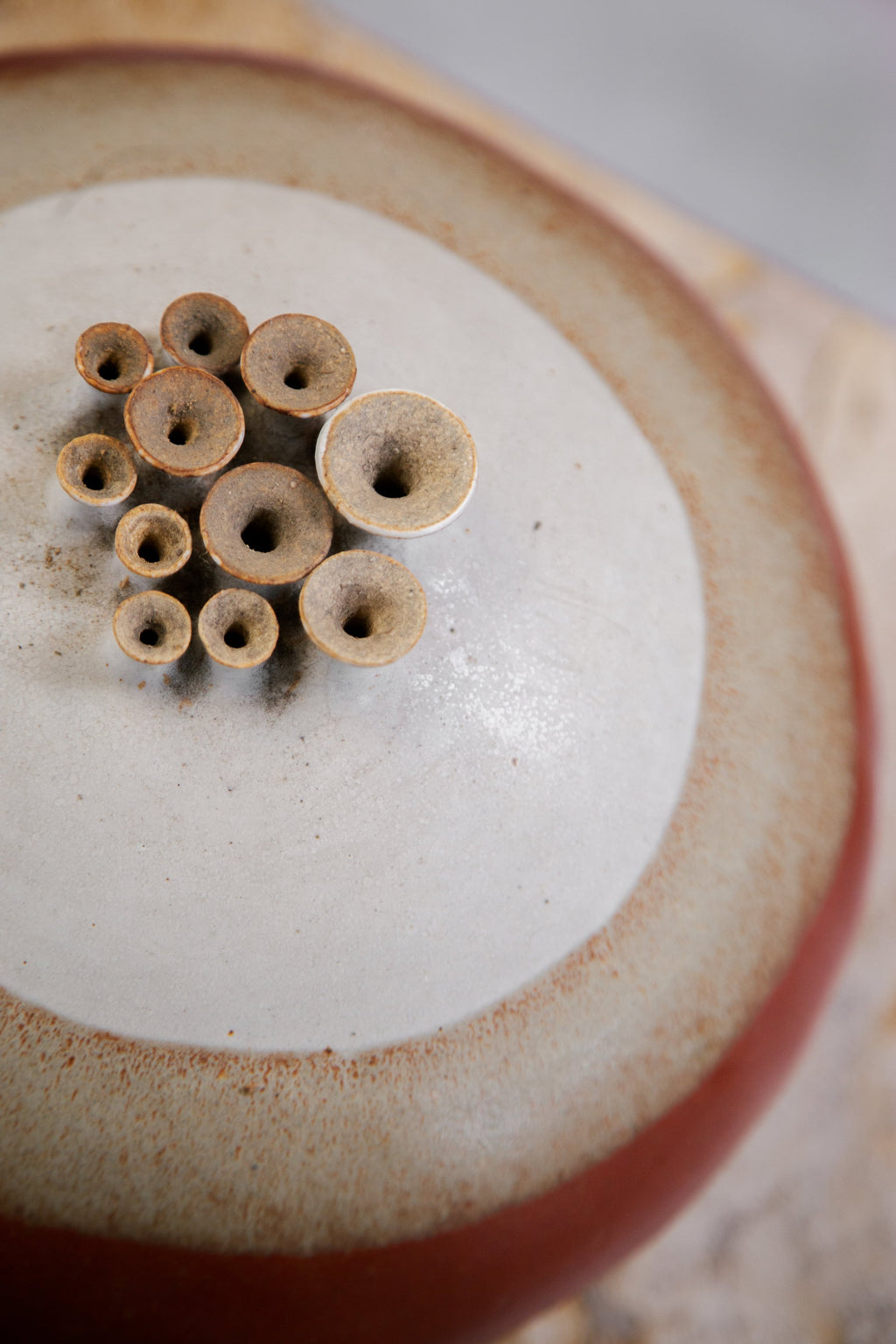 Artistic ceramic weedpot featuring multiple holes and signed craftsmanship, an expressive mid-century pottery accent — Hommes and Gardens, Objects, Pots + Planters Collection, home decor, outdoor decorations, home design, luxury design, Landscape Architect, Interior Designer, Outdoor Living, Art, Furniture, Objects, Best Gifts, Nature, Backyard, Yard.