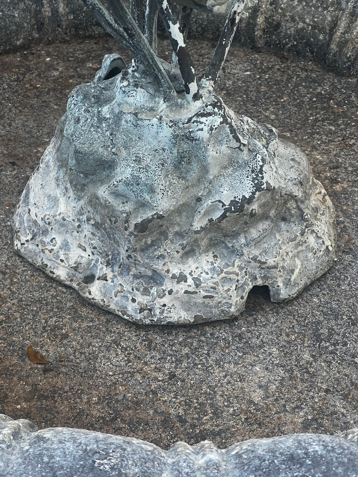 Close-up of the base of a Vintage Verdigris Copper Lily Pad & Frog Fountain showing intricate textures and patina. hommes + gardens estudio.