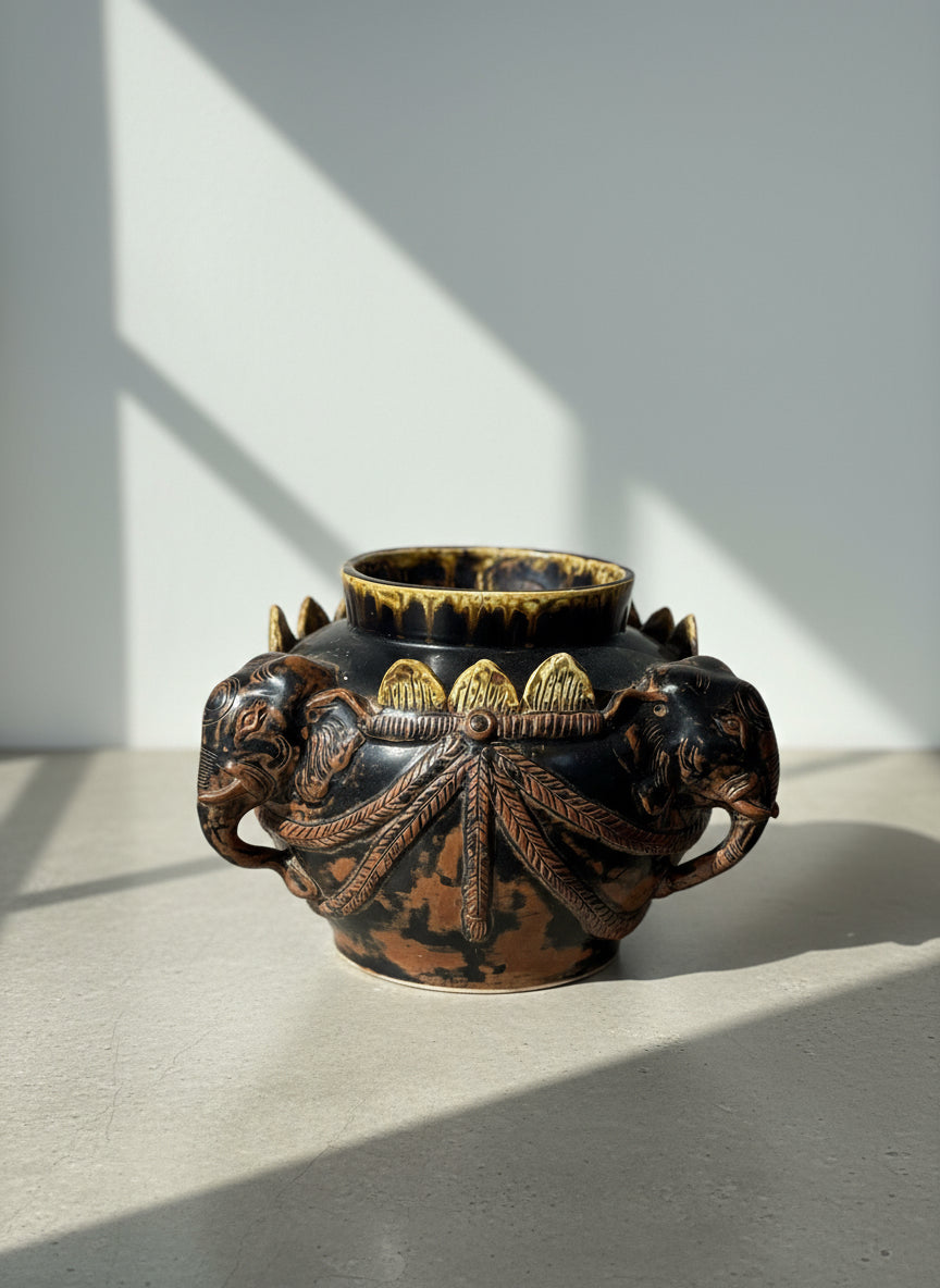 Antique Elephant Motif Ceramic Vessel with Gilded Accents featuring intricate elephant head handles, hommes + gardens estudio.
