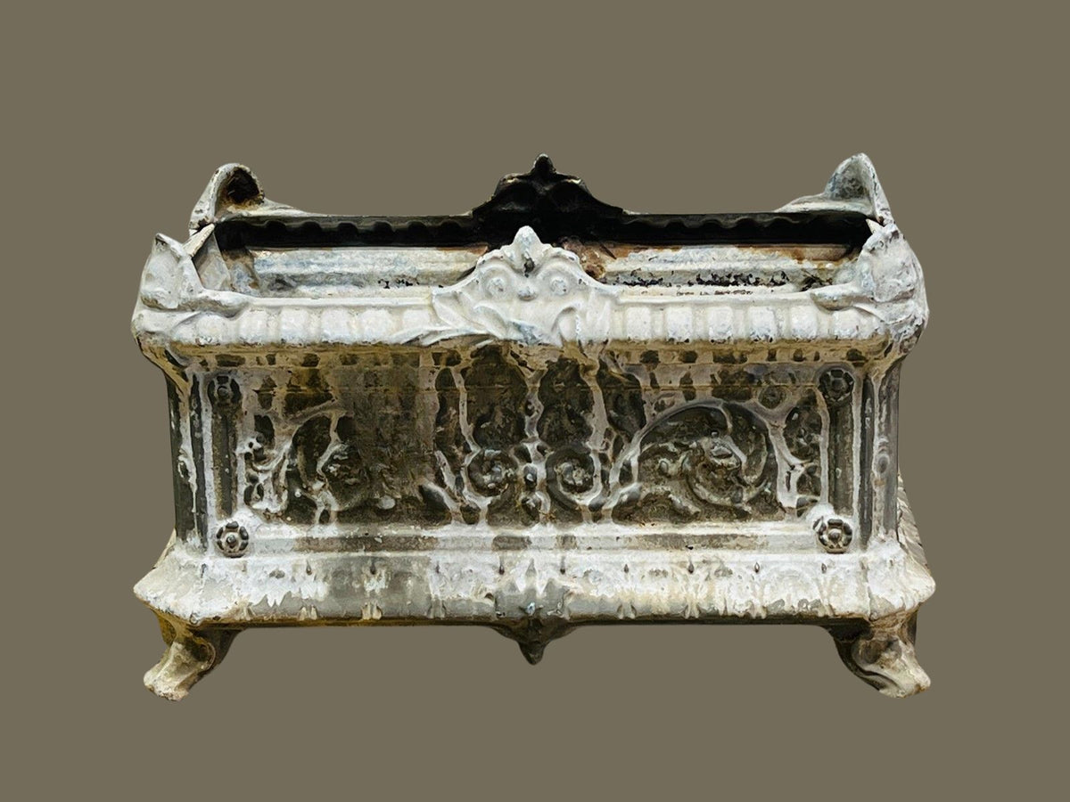Handcrafted antique French cast iron urn planter with clawed feet, ornamental reliefs, and distressed paint patina for a classic European garden look — Hommes and Gardens, Pots + Planters Collection, Landscape Architect, Interior Designer, Outdoor Living, Art, Furniture, Objects, Best Gifts, Nature, Backyard, Yard, Outdoor Decorations, Home Decor, Home Design, Luxury Design.