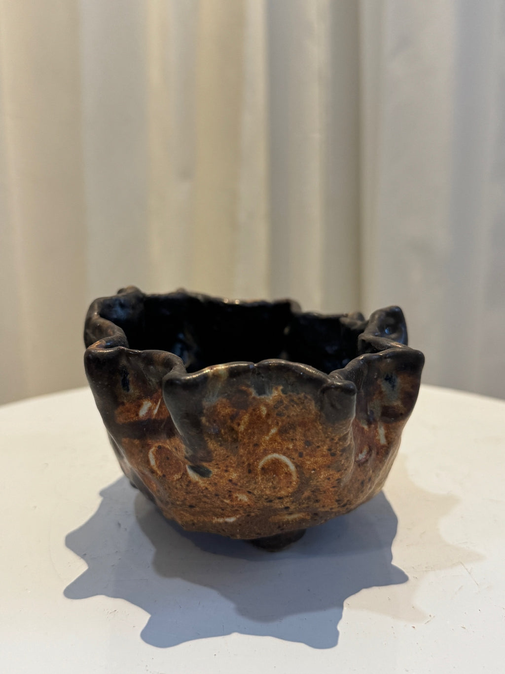 Handcrafted freeform ceramic vase in studio pottery style with earthy glaze and tactile surface indentations, inspired by wabi-sabi aesthetics — Hommes and Gardens, Vases + Vessels Collection, Landscape Architect, Interior Designer, Outdoor Living, Art, Furniture, Objects, Best Gifts, Nature, Backyard, Yard, Outdoor Decorations, Home Decor, Home Design, Luxury Design.