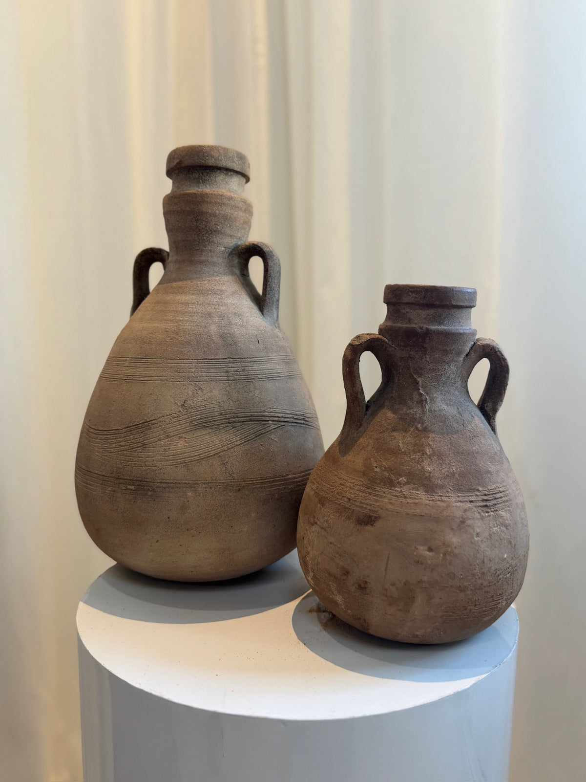 Handcrafted Roman-style terracotta amphora with natural earthen patina and narrow neck, inspired by ancient pottery used for wine and oil — Hommes and Gardens, Vases + Vessels Collection, Landscape Architect, Interior Designer, Outdoor Living, Art, Furniture, Objects, Best Gifts, Nature, Backyard, Yard, Outdoor Decorations, Home Decor, Home Design, Luxury Design.