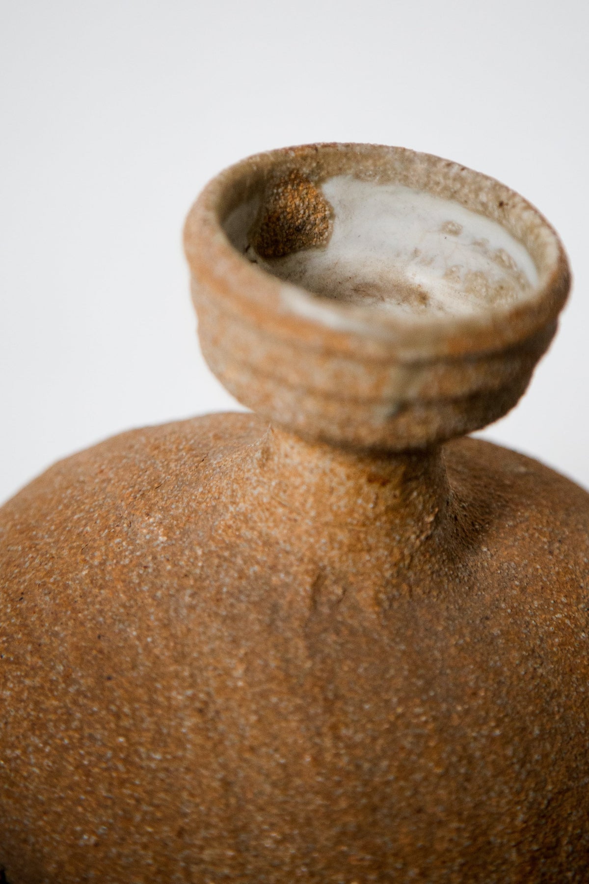 Vintage Ceramic Face Water Dispenser details with organic texture and neutral colors, handcrafted for elegance. hommes + gardens estudio.