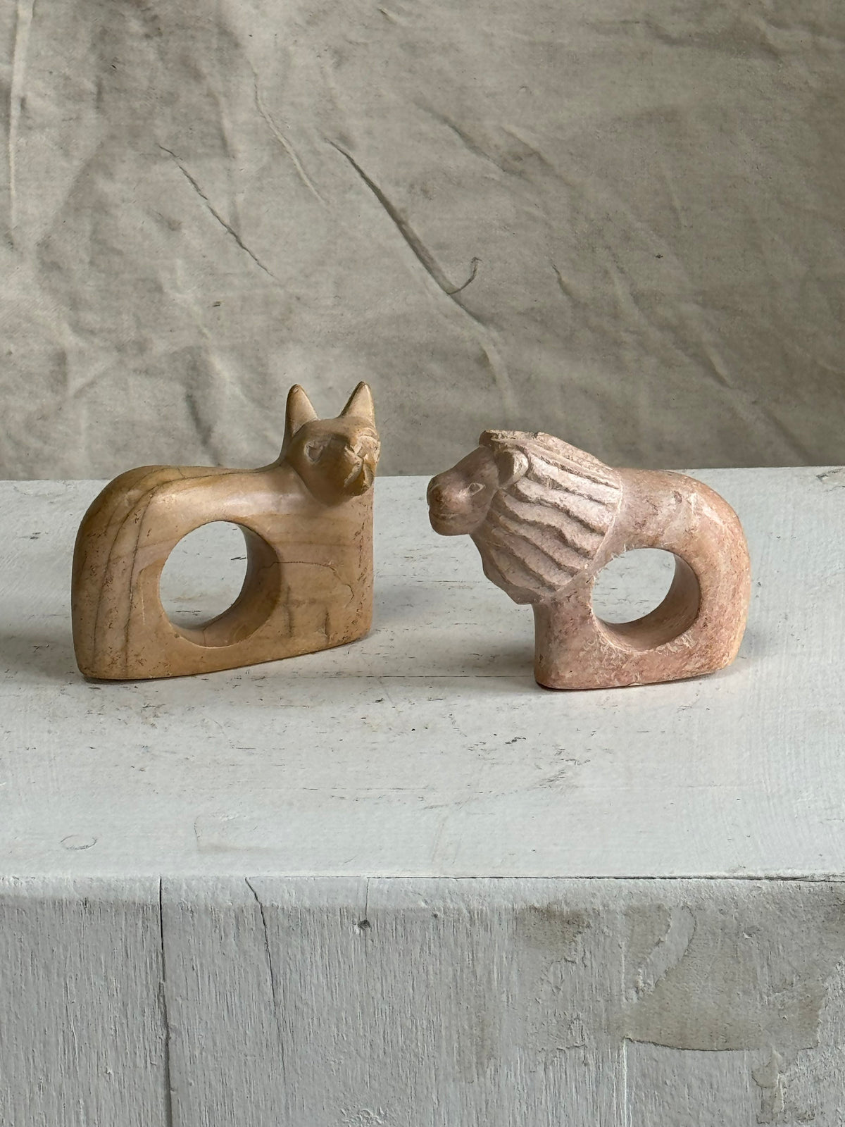 Handmade Kenyan soapstone cat and lion napkin rings, set of two carved African pieces celebrating wildlife artistry and cultural heritage — Hommes and Gardens, Fauna Collection, Landscape Architect, Interior Designer, Outdoor Living, Outdoor Decorations, Home Decor, Home Design, Luxury Design, Art, Furniture, Objects, Best Gifts, Nature, Backyard, Yard.