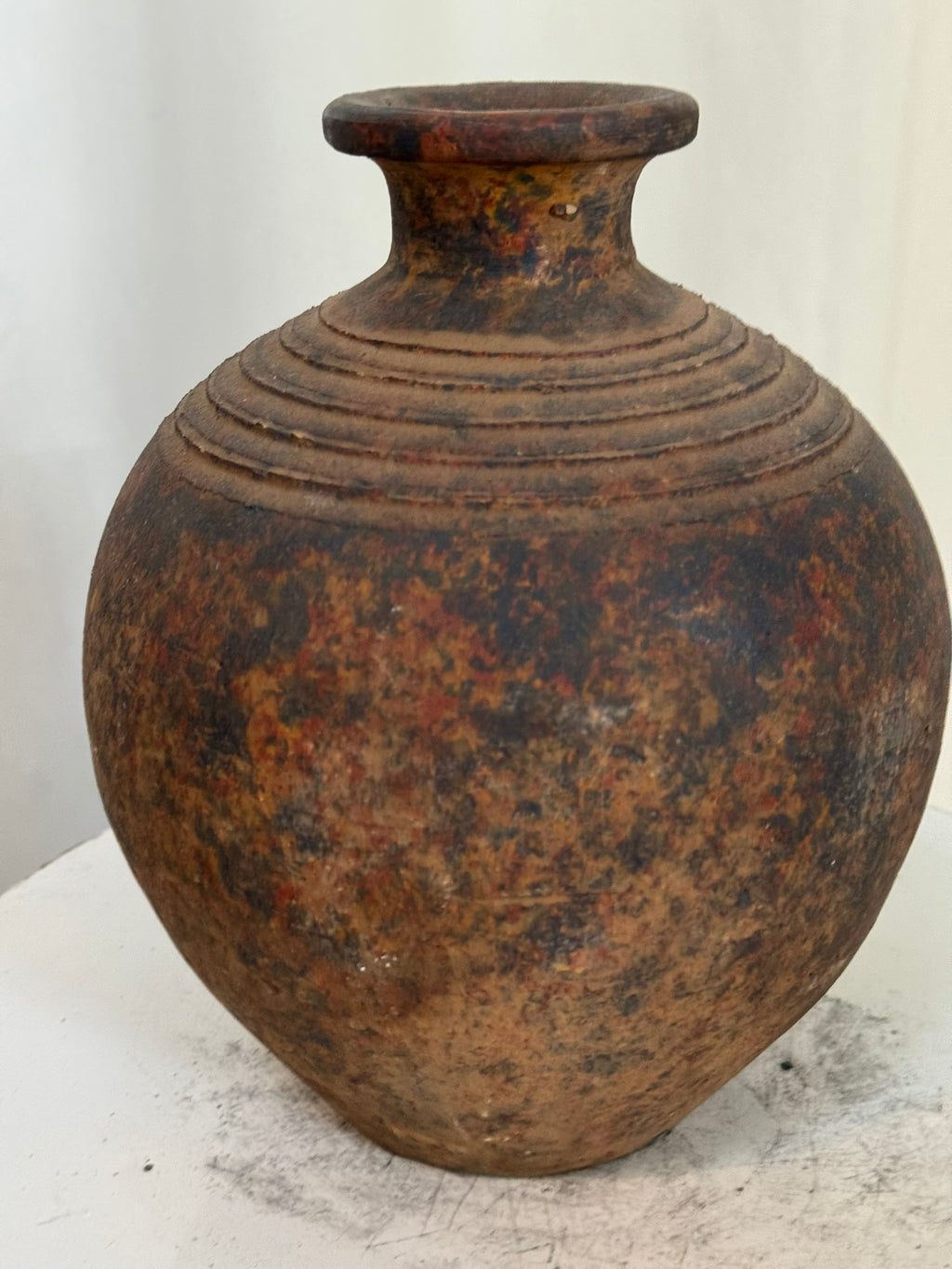 Handmade rustic pottery vase featuring earthy tones of brown, burnt orange, and black with aged finish, reflecting traditional craftsmanship — Hommes and Gardens, Vases + Vessels Collection, Landscape Architect, Interior Designer, Outdoor Living, Art, Furniture, Objects, Best Gifts, Nature, Backyard, Yard, Outdoor Decorations, Home Decor, Home Design, Luxury Design.