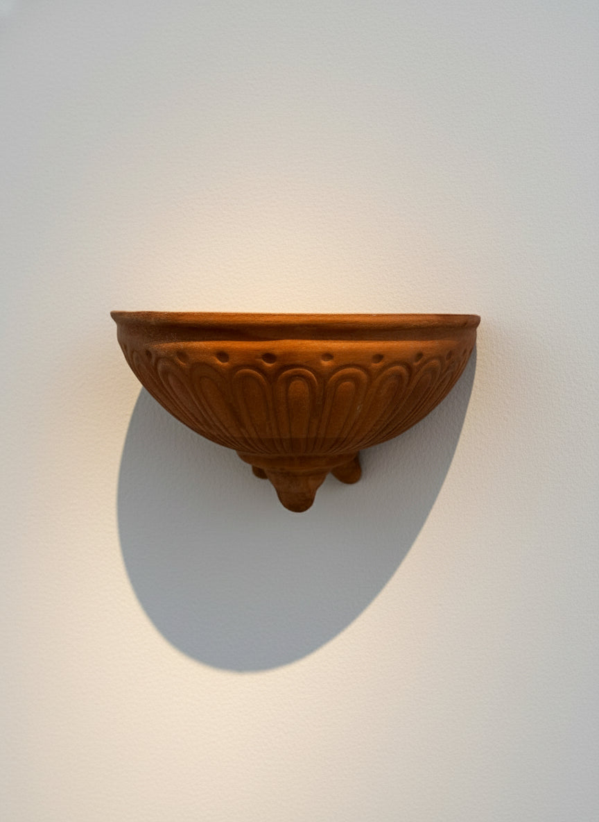Vintage Italian Terracotta Wall Pocket Planter – Handcrafted Fluted Design mounted on wall, showcasing its elegant relief design. hommes + gardens estudio.