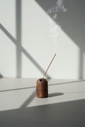 Mid-century incense holder in warm brown ceramic with weathered finish and triangular cutouts, reflecting classic vintage design — Hommes and Gardens, Smoke + Fire Collection, Landscape Architect, Interior Designer, Outdoor Living, Outdoor Decorations, Home Decor, Home Design, Luxury Design, Art, Furniture, Objects, Best Gifts, Nature, Backyard, Yard.