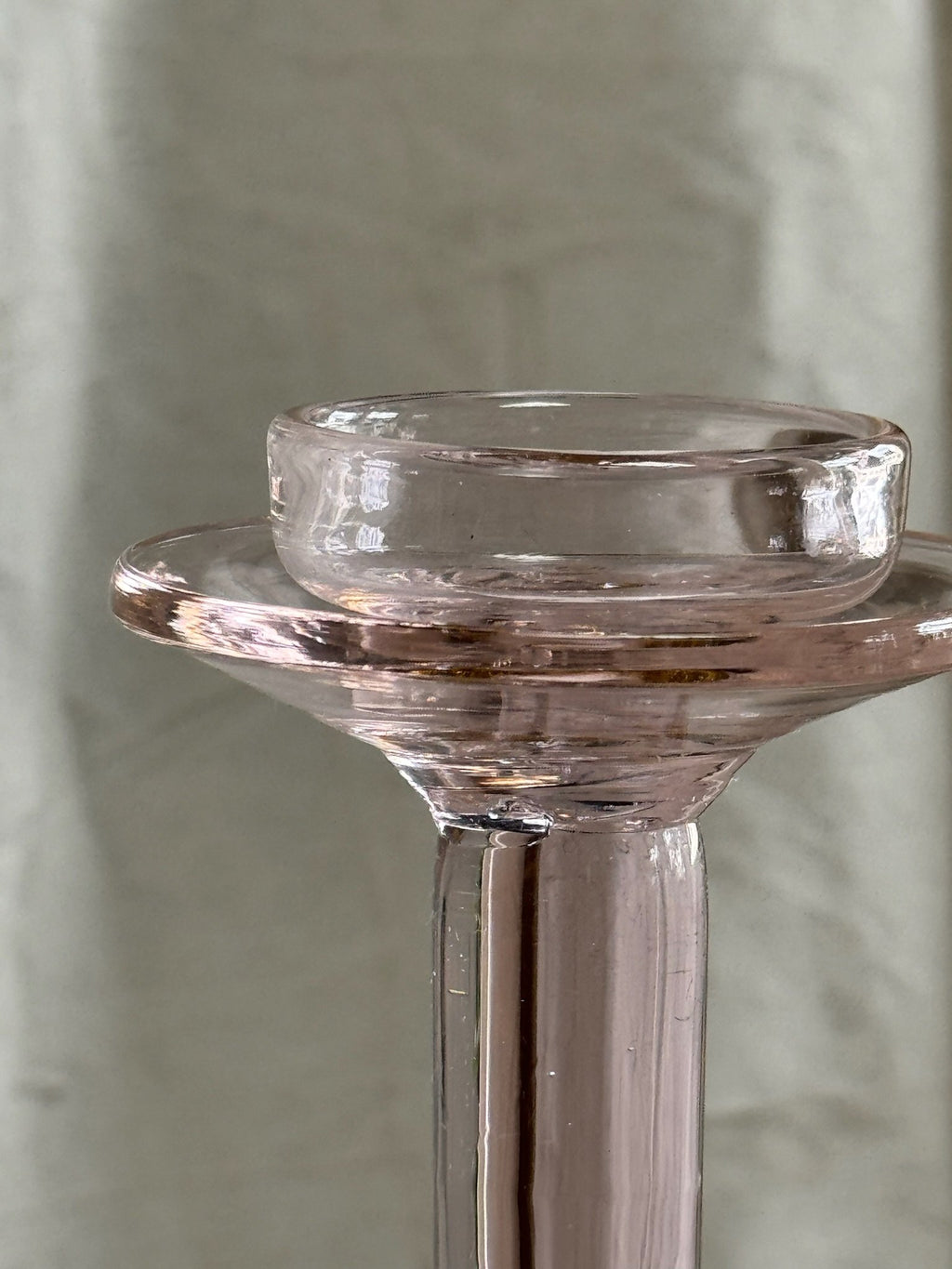 Close-up of Vintage Pink Glass Candle Holder showcasing its elegant design and soft rosy hue. hommes + gardens estudio.