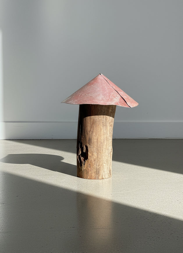 Rustic Handmade Mushroom Sculpture – Weathered Log Stem with Red Metal Cap, showcasing natural wood textures and aged metal details. hommes + gardens estudio.