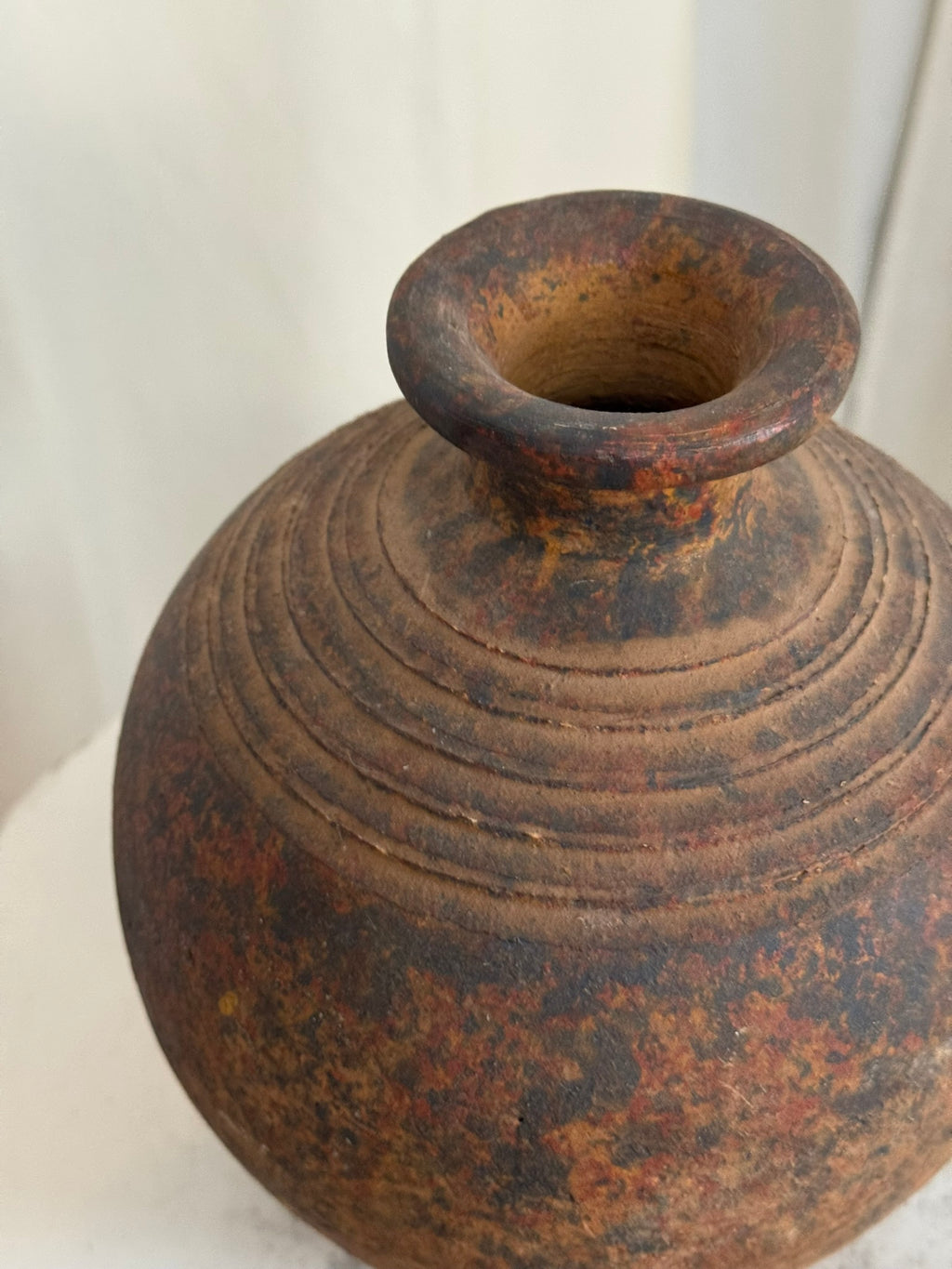Rustic handcrafted studio pottery vase with naturally aged patina, earthy brown and black hues, and concentric ridges highlighting artisan craftsmanship — Hommes and Gardens, Vases + Vessels Collection, Landscape Architect, Interior Designer, Outdoor Living, Art, Furniture, Objects, Best Gifts, Nature, Backyard, Yard, Outdoor Decorations, Home Decor, Home Design, Luxury Design.