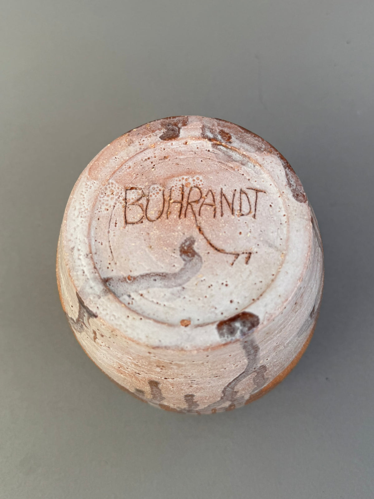 Bottom view of a Signed Buhrandt Studio Art Pottery Cup – Handcrafted Abstract Glazed Stoneware Vessel showcasing the artist's signature. hommes + gardens estudio.