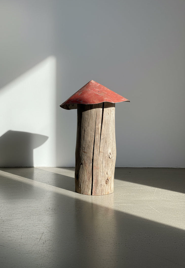 Rustic Handmade Mushroom Sculpture – Tall Weathered Log Stem with Red Metal Cap, showcasing aged wood and a red-painted cap. hommes + gardens estudio.