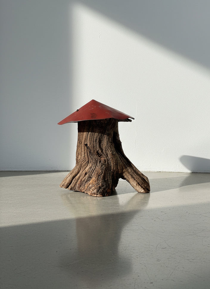 Rustic Primitive Folk Art Sculpture – Weathered Tree Stump with Red Metal Roof on display. hommes + gardens estudio.