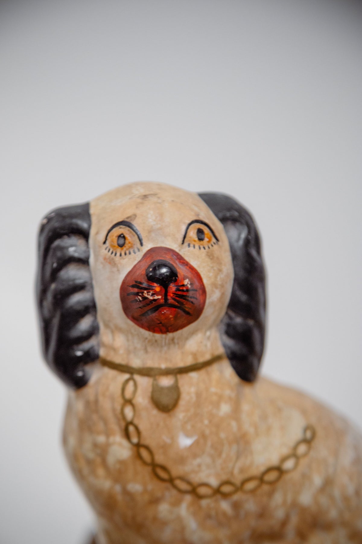 Close-up of a Victorian Pair of Staffordshire Dog Figurines showcasing intricate details and craftsmanship, hommes + gardens estudio.