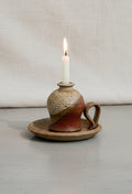 Vintage Chamber Stick Candle Holder Glazed Stoneware with a candle, showcasing warm brown and beige hues, hommes + gardens estudio.
