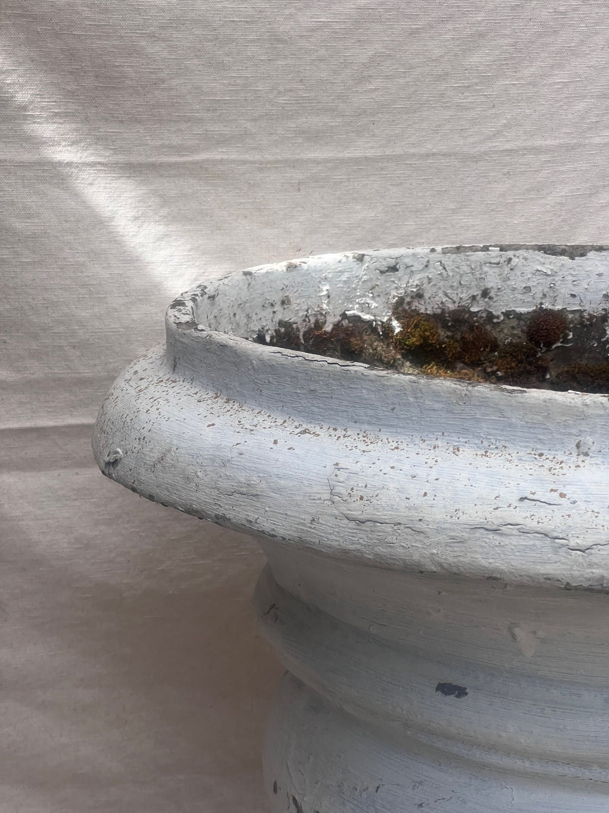 large outdoor concrete urn planter with patina