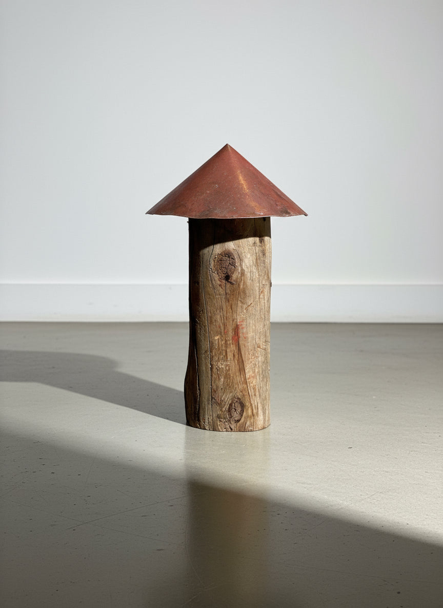Rustic Handmade Mushroom Sculpture – Log Stem with Wide Red Metal Cap on a clean surface, showcasing its unique design. hommes + gardens estudio.