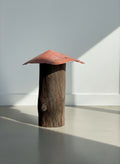 Rustic Primitive Folk Art Sculpture – Weathered Wood Post with Wide Red Metal Roof showcased in natural light. hommes + gardens estudio.