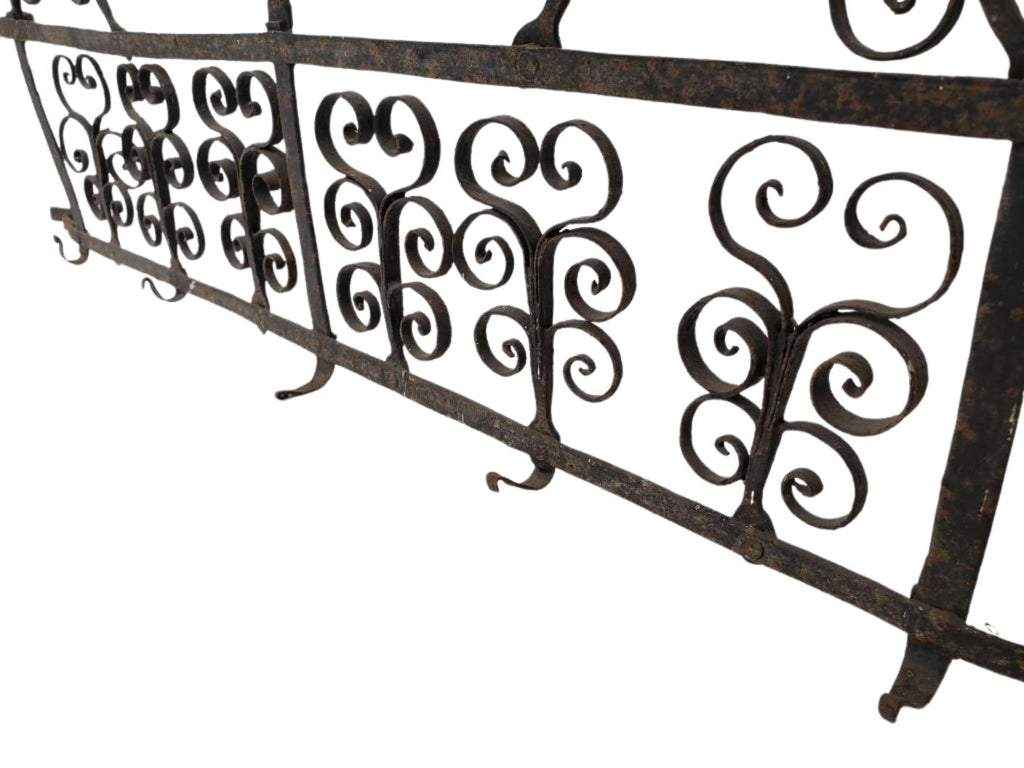 Antique 17th-Century Spanish Style Wrought Iron Wall Rack with Bird Motif showcasing intricate scrollwork and decorative design. hommes + gardens estudio.