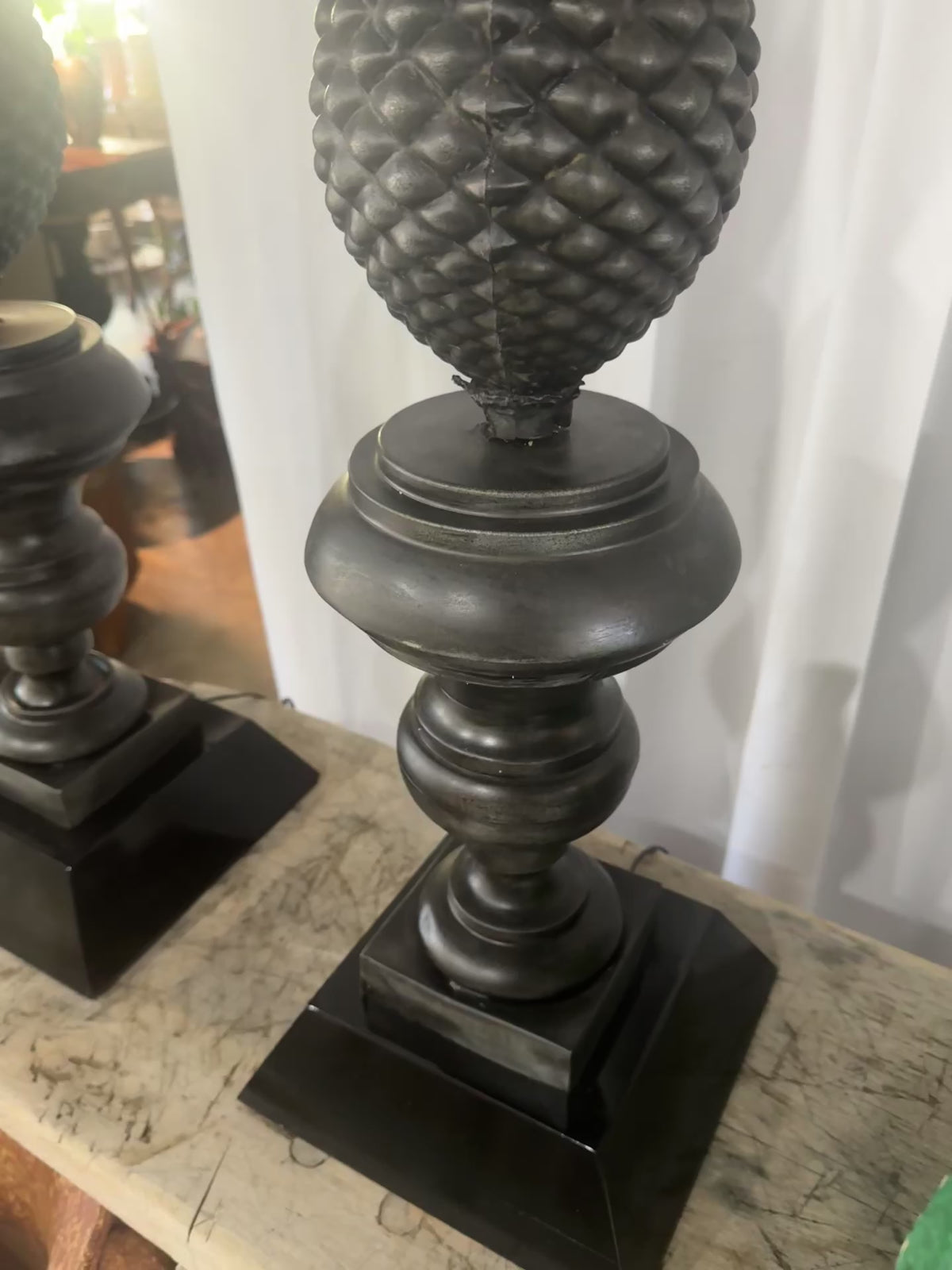 Ornate vintage metal pineapple lamps with black drum shades, restored neoclassical design symbolizing hospitality and timeless elegance — Hommes and Gardens, Lights + Lanterns Collection, Landscape Architect, Interior Designer, Outdoor Living, Art, Furniture, Objects, Best Gifts, Nature, Backyard, Yard, Outdoor Decorations, Home Decor, Home Design, Luxury Design.