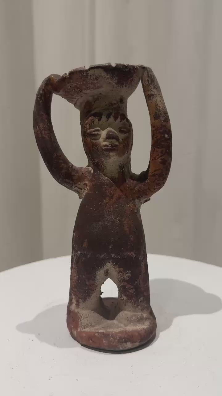Pre-Columbian Style Terracotta Ritual Figure With Raised Arms displayed on a pedestal, handcrafted and evocative, hommes + gardens estudio.