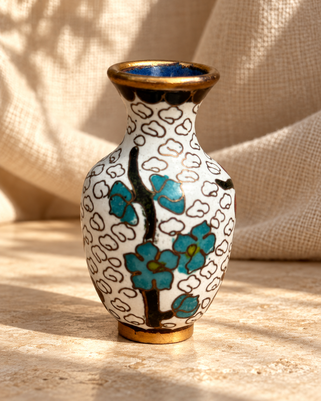 Side view of Chinese cloisonné enamel bud vase with white ground, red floral decoration and brass-toned accents — Hommes and Gardens, Vases + Vessels Collection, Objects + Curiosities Collection, Home Decor, Interior Designer, Home Design, Luxury Design, Art, Objects, Chinese Design, Asian Decor, Cloisonné Enamel, Decorative Arts.